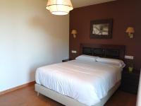 Postel nebo postele na pokoji v ubytování Apartamentos Rurales El Mirador de San Juan