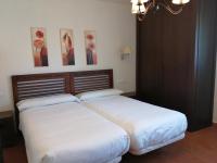 Postel nebo postele na pokoji v ubytování Apartamentos Rurales El Mirador de San Juan