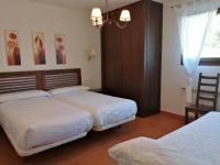 Postel nebo postele na pokoji v ubytování Apartamentos Rurales El Mirador de San Juan