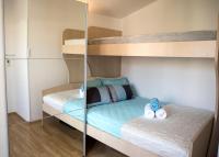 Postel nebo postele na pokoji v ubytování Penthouse Apartment LUX with a panoramic view, located on the beachfront of Ciovo-Trogir