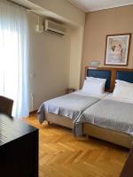 Posteľ alebo postele v izbe v ubytovaní Adams Hotel
