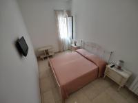 A bed or beds in a room at La Nuova Casetta