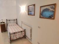 A bed or beds in a room at La Nuova Casetta