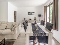 a dining room and living room with a table and chairs at Holiday Home with Roofed Swimming Pool in Villeneuve-sur-Lot