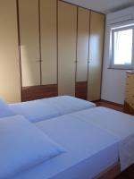 Postel nebo postele na pokoji v ubytování Apartments Rea