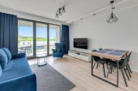 Televízia a/alebo spoločenská miestnosť v ubytovaní Tarasy Bałtyku Sea Side, Sauna & Gym by Downtown Apartments