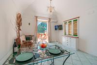 Televízia a/alebo spoločenská miestnosť v ubytovaní Maison Ciccio - il Monticello con Sauna Privata