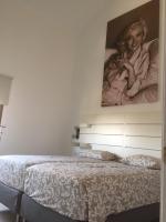 Łóżko lub łóżka w pokoju w obiekcie Casa Monroe op Oasis Tamarindo 1