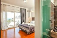 Posteľ alebo postele v izbe v ubytovaní Unique Sea & Sunset Residence