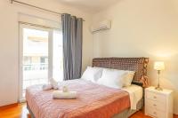 Posteľ alebo postele v izbe v ubytovaní Unique Sea & Sunset Residence