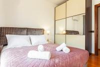 Posteľ alebo postele v izbe v ubytovaní Unique Sea & Sunset Residence