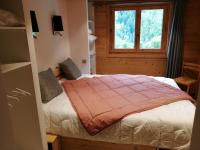 Łóżko lub łóżka w pokoju w obiekcie Chalet Cathy et Michel
