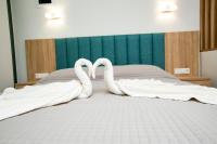 Posteľ alebo postele v izbe v ubytovaní Mythos Bungalows