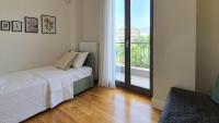 Posteľ alebo postele v izbe v ubytovaní Malamas Apartment