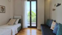 Posteľ alebo postele v izbe v ubytovaní Malamas Apartment