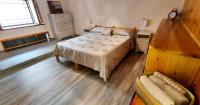 A bed or beds in a room at Casa Enea