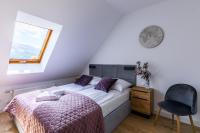 Postel nebo postele na pokoji v ubytování Apartamenty Krupówki 48B