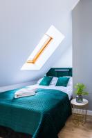 Postel nebo postele na pokoji v ubytování Apartamenty Krupówki 48B