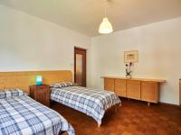 Łóżko lub łóżka w pokoju w obiekcie Apartment Punto Lago by Interhome