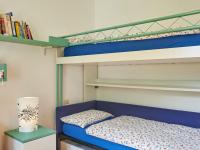 Łóżko lub łóżka w pokoju w obiekcie Apartment Punto Lago by Interhome