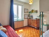 Łóżko lub łóżka w pokoju w obiekcie Apartment Punto Lago by Interhome