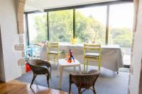Posedenie v ubytovaní Treffiagat - Grande maison pour 9 - Jardin