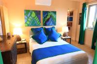 A bed or beds in a room at Mikipong