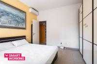 A bed or beds in a room at Bergonzoni Modern Apartment by Wonderful Italy