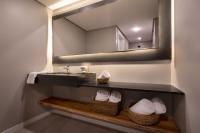 a bathroom with a sink and a mirror at Jangal das Araucárias Swan Design Hotel Canela in Canela