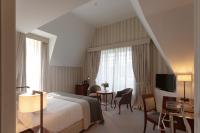 Łóżko lub łóżka w pokoju w obiekcie Hotel Villa Soro