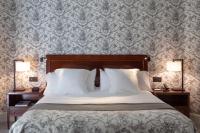 Łóżko lub łóżka w pokoju w obiekcie Hotel Villa Soro