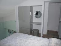 Posteľ alebo postele v izbe v ubytovaní Attic Apartments