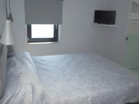 Posteľ alebo postele v izbe v ubytovaní Attic Apartments