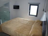 Posteľ alebo postele v izbe v ubytovaní Attic Apartments