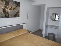 Posteľ alebo postele v izbe v ubytovaní Attic Apartments