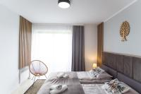 Posteľ alebo postele v izbe v ubytovaní Apartament Tatry55