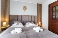 Posteľ alebo postele v izbe v ubytovaní Apartament Tatry55