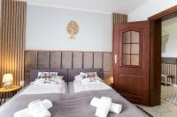 Posteľ alebo postele v izbe v ubytovaní Apartament Tatry55
