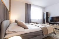 Televízia a/alebo spoločenská miestnosť v ubytovaní Apartament Tatry55