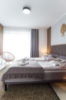 Posteľ alebo postele v izbe v ubytovaní Apartament Tatry55