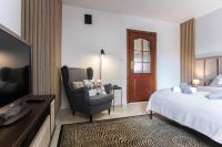 Posteľ alebo postele v izbe v ubytovaní Apartament Tatry55