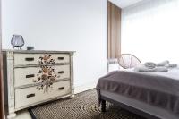 Posteľ alebo postele v izbe v ubytovaní Apartament Tatry55
