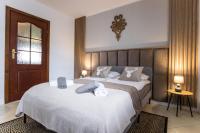 Posteľ alebo postele v izbe v ubytovaní Apartament Tatry55