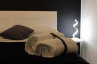 A bed or beds in a room at Essenza del Tempo Inn