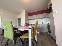 a kitchen with a table and chairs in a room at Appartement La Rochelle, 3 pièces, 4 personnes - FR-1-246-588 in La Rochelle