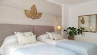 Postel nebo postele na pokoji v ubytování Hotel Nou Can Guillem