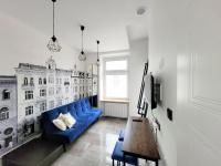 Televízia a/alebo spoločenská miestnosť v ubytovaní Grand Theater Apartments