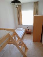 Łóżko lub łóżka w pokoju w obiekcie Flauta Apartamenty Rodzinne