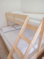 Łóżko lub łóżka w pokoju w obiekcie Flauta Apartamenty Rodzinne