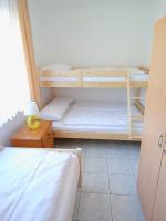 Łóżko lub łóżka w pokoju w obiekcie Flauta Apartamenty Rodzinne